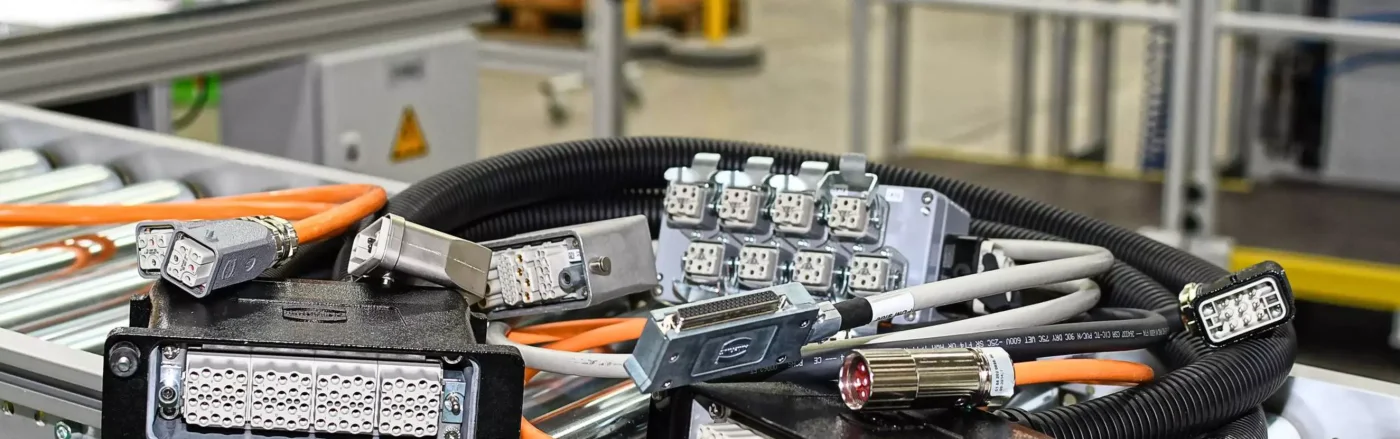 A solution family consisting of HARTING custom cable assemblies and industrial connectors.