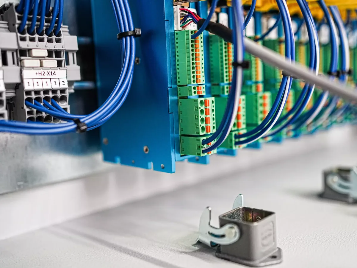 Green HARTING har-flexicon PCB terminal blocks inside the control device.